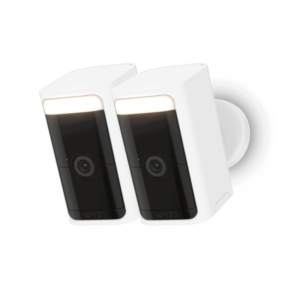 Wyze Battery Cam Pro -: Two Wyze cameras on a white background.